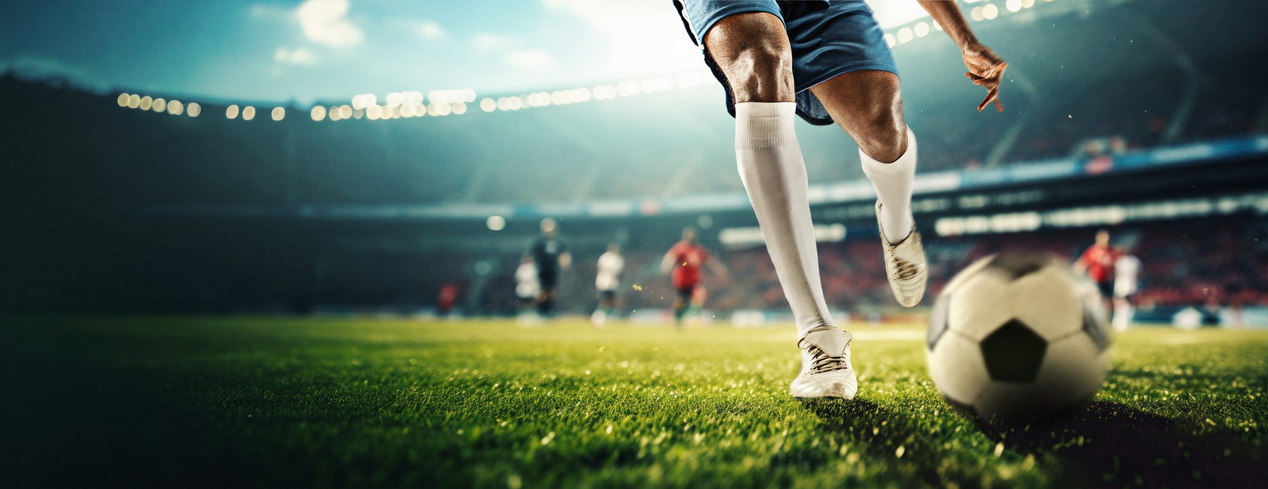 cropped,male,legs,hitting,ball,,players,during,game,on,open