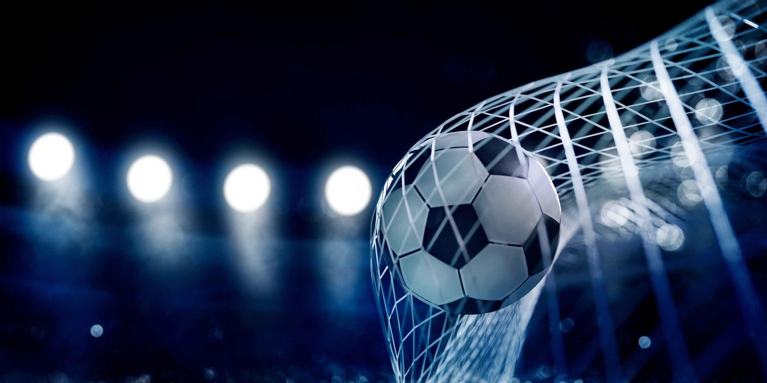closeup,of,soccer,ball,in,goal,net.,football,play,in