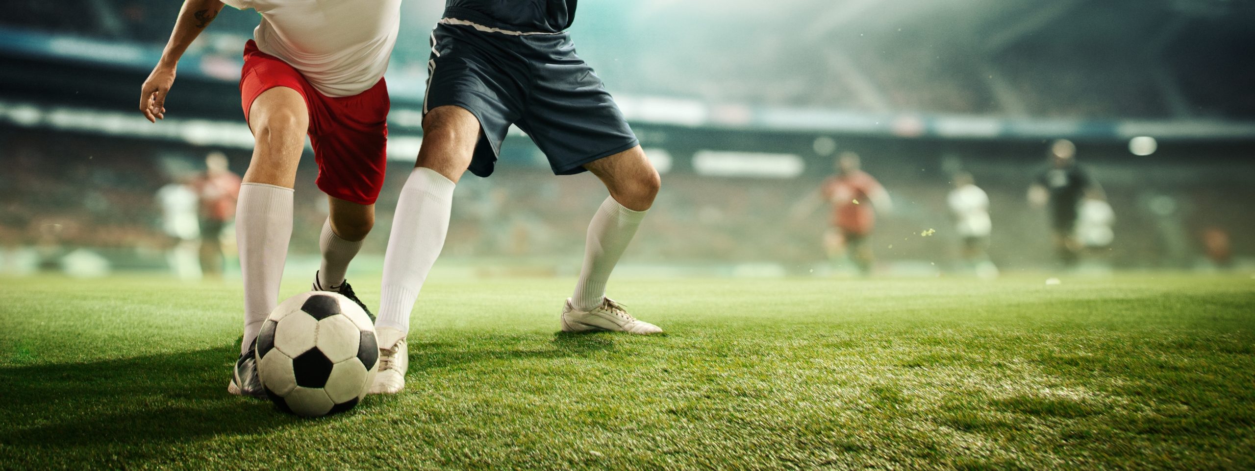dynamic,image,of,male,legs,,football,players,in,motion,on